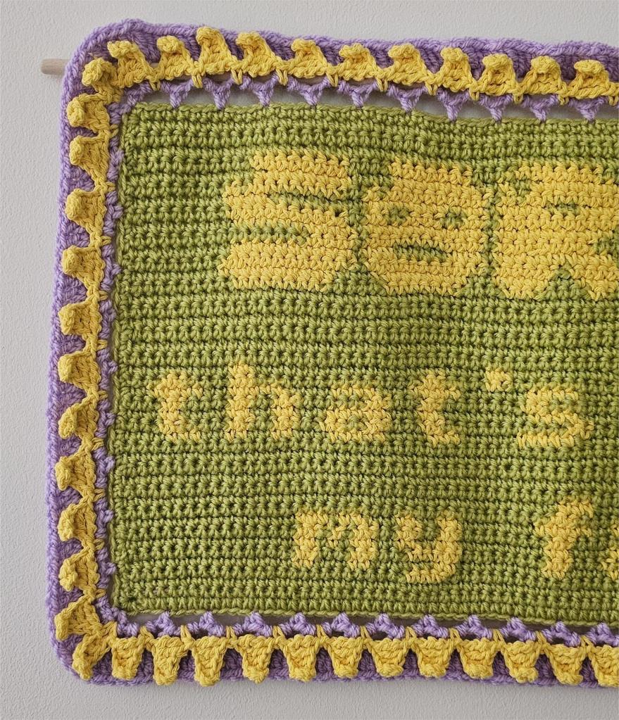 A detail view of the crochet piece 'Mantra for Unmasking'